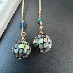 May include: A set of three ceramic mugs with a speckled, matte finish. The mugs are in shades of cream, light gray, and dark gray. Each mug has a simple, modern design and a rounded handle.