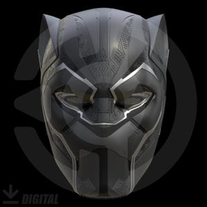 May include: A detailed black and silver Black Panther mask. The mask has a sleek design with angular lines and textured patterns. The eyes and mouth are visible. The mask is set against a black background.