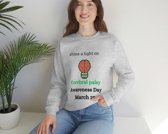 May include: Gray sweatshirt with the text "shine a light on Cerebral palsy Awareness Day March 25" and a lightbulb graphic with a brain inside.