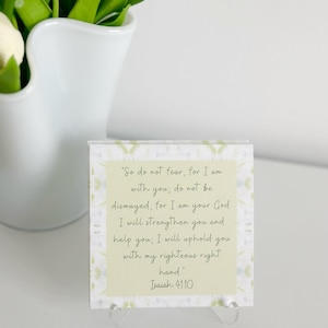 May include: A square card with a light green background and the text "So do not fear, for I am with you; do not be dismayed, for I am your God. I will strengthen you and help you; I will uphold you with my righteous right hand. Isaiah 41:10."