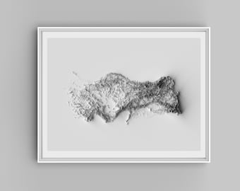 May include: A white framed print of a 3D topographic map of Turkey. The map is raised and textured, showing the country's mountains and valleys.