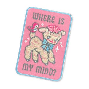 May include: A rectangular embroidered patch with a pink background and a light blue border. It features a beige lamb with a blue bow, a pink bird, and a pink brain on its head. The text "WHERE IS MY MIND?" is embroidered in dark gray.