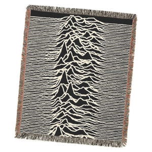 May include: Black and white woven throw blanket featuring a mountain range design. The blanket has a fringed edge with a mix of colors. The design is a series of white lines on a black background, creating a topographic effect.