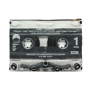 May include: Clear zippered pouch featuring a cassette tape design. The black and white graphic includes the album title "Doolittle" by Pixies, song titles, and production details. The pouch has a black zipper and a gold-colored zipper pull.
