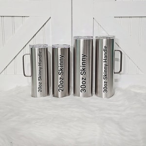 May include: Four stainless steel tumblers with handles. The tumblers are labeled with their size and type: 20oz Skinny Handle, 20oz Skinny, 30oz Skinny, and 30oz Skinny Handle.