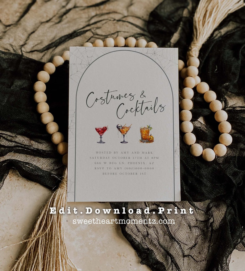 May include: A rectangular invitation card with the text "Costumes & Cocktails" in elegant script. The card features watercolor illustrations of three cocktails. Additional text includes event details and a website address.