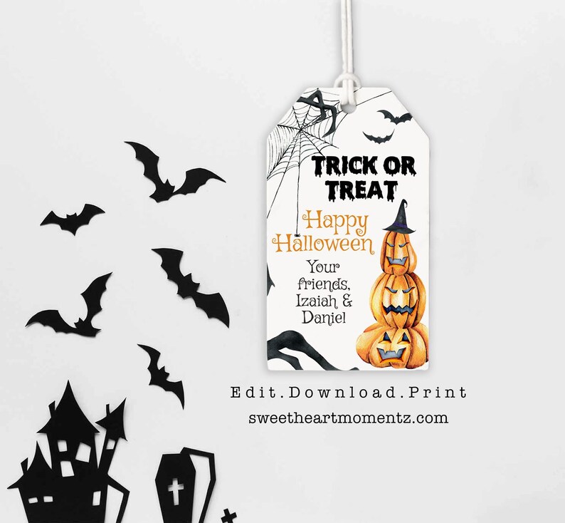 May include: A Halloween-themed gift tag with a watercolor illustration of stacked pumpkins, bats, and a spiderweb. The tag reads "Trick or Treat" and "Happy Halloween" with a personalized message. The website address is also visible.