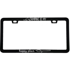 May include: Black license plate frame with white text that reads "CAMPING IS MY" and "happy place". The frame has a tent and campfire graphic. The frame is rectangular with rounded corners and mounting holes.