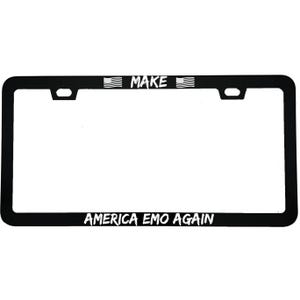 May include: Black license plate frame with the text "MAKE" above and "AMERICA EMO AGAIN" below. The word "MAKE" is between two small American flags. The frame has a rectangular shape with rounded corners.