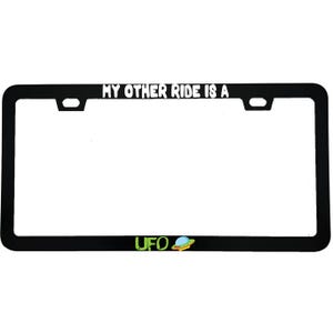 May include: A black rectangular license plate frame featuring the white text MY OTHER RIDE IS A at the top. The bottom section displays the green text UFO followed by a small, colorful graphic of a flying saucer with a blue dome and yellow base.