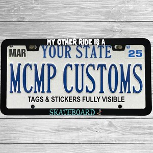 "My Other Ride Is A Skateboard" license plate frame shown on vehicle — lifestyle photo