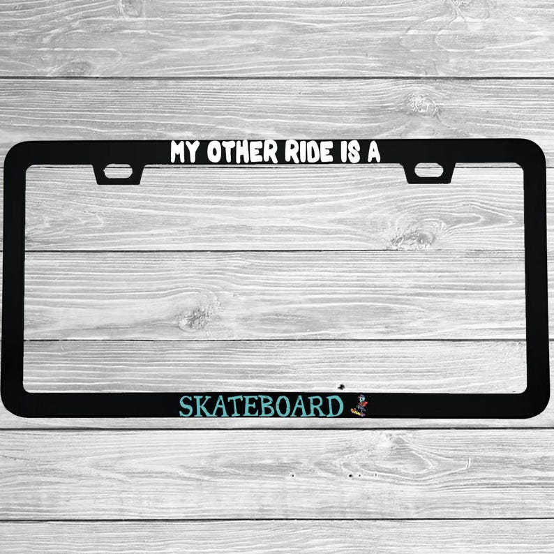 Close-up of "My Other Ride Is A Skateboard" license plate frame showing fade-proof print quality