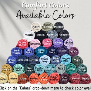 May include: Image showcasing a variety of Comfort Colors t-shirts in a range of hues. The available colors are displayed in a pyramid arrangement, with labels such as "White," "Black," "Watermelon," and "Blue Jean." The text "Comfort Colors Available Colors" is at the top.
