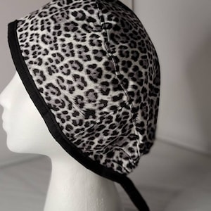 Black/White Cheetah Print Scrub Hat/Cap with Black Trim Band