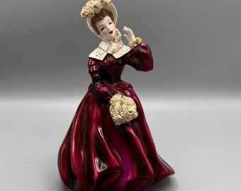 Florence Ceramics of California Semi-Porcelain Woman Figurine in a Pinkish-Red Dress