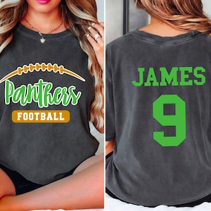 May include: A black t-shirt with a green and brown graphic of a football and the text "Panthers Football". The back of the shirt has the text "JAMES 9" in green.