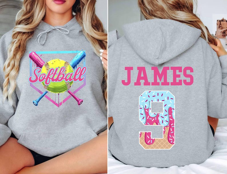 May include: Gray hooded sweatshirt with a softball graphic on the front and the name "JAMES" and a number "9" with a pink and blue ice cream design on the back.