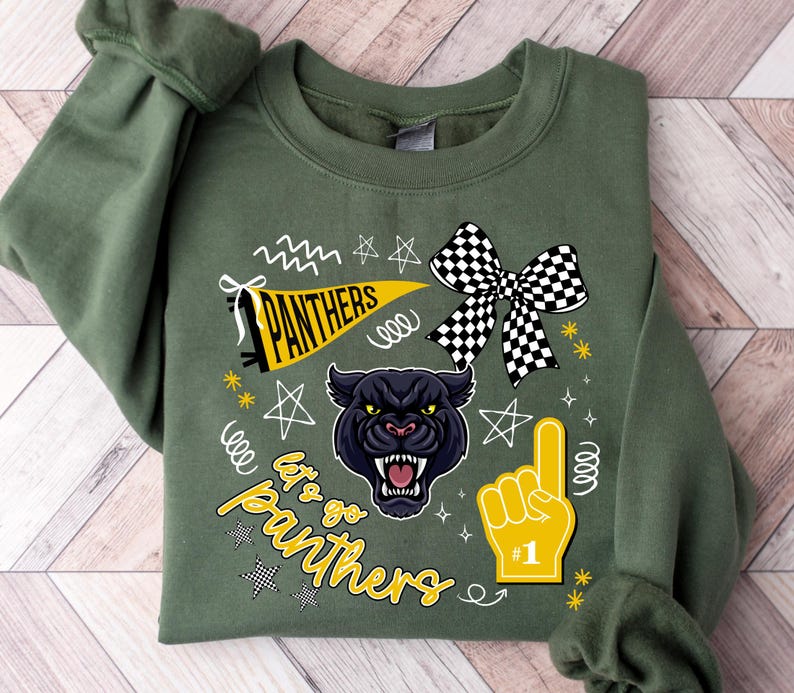 May include: Olive green sweatshirt with a graphic design featuring a black panther, a yellow pennant with "PANTHERS" text, a checkered bow, and a foam finger. The text "Let's go Panthers" is also included.
