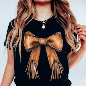 Western Cowgirl Bow Shirt, Coquette Cowgirl Bow Shirt, Howdy Brown Leather Bow Shirt, Coquette Aesthetic Cute Mom Gift, Cowhide Bow T-Shirt