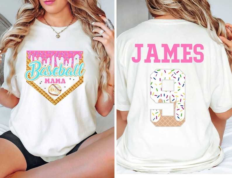 May include: White t-shirt with a pink, blue, and yellow baseball-themed graphic that says "Baseball Mama" on the front. The back of the shirt has the name "JAMES" in pink letters and a number "9" with sprinkles on it.