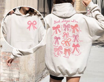 God Says I Am Coquette Bow Hoodie, Christian Mom Hoodie, Christian Girl Gifts, Hoodie,Women's Christian Hoodie, Pink Bible Verse Mama Hoodie