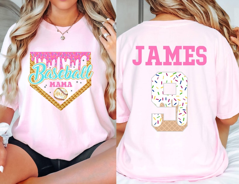 May include: Pink baseball t-shirt with a baseball diamond graphic and the text "Baseball Mama". The back of the shirt has the name "JAMES" and the number "9" with a sprinkle-covered ice cream cone design.