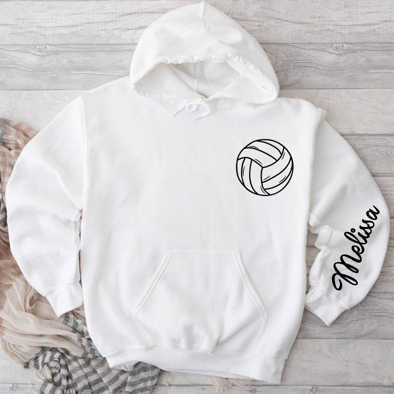 May include: White hooded sweatshirt with a black volleyball graphic and the name "Melissa" on the sleeve.