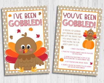 May include: Two printable signs with a Thanksgiving theme. The signs feature a cartoon turkey and the text "I've Been Gobbled!" and "You've Been Gobbled!" The second sign includes instructions for a fun office game.
