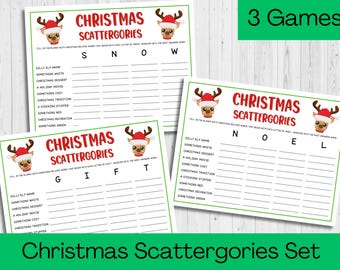 May include: Three printable Christmas Scattergories game cards featuring a cartoon reindeer with a red Santa hat. Each card has a different set of letters to use for the game: SNOW, GIFT, and NOEL. The cards are designed for a Christmas party or family gathering.