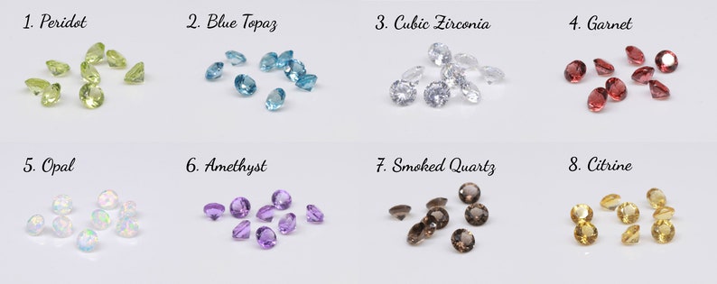 May include: Assortment of loose gemstones in various colors, including peridot, blue topaz, cubic zirconia, garnet, opal, amethyst, smoked quartz, and citrine.