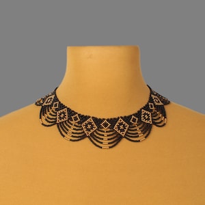May include: A black and gold beaded necklace with a geometric pattern. The necklace is layered with multiple strands of beads and has a scalloped shape.
