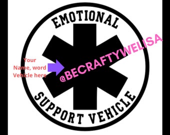 May include: Black and white sticker with a red star of life symbol in the center. The text "Emotional Support Vehicle" is written around the star of life. The text "@BECRAFTYWELISA" is written in pink on the sticker.