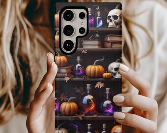 May include: A phone case featuring a Halloween-themed design. The case depicts a bookshelf with pumpkins, potion bottles, skulls, and books. The bottles have glowing purple and orange liquids. The overall color scheme is dark with autumn leaves.