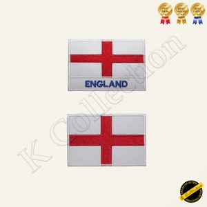 Może przedstawiać: Dwa haftowane naszywki z flagą Anglii. Górna naszywka ma napis "ENGLAND" wyszyty pod flagą.