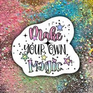 May include: A white sticker with a pink, green, and blue gradient background. The sticker features a white cloud shape with the text "Make your own magic" in black and pink lettering. The sticker is decorated with small white stars.