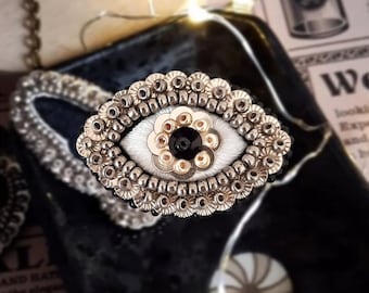 The Fabularium - Hand embroidered golden eye brooch