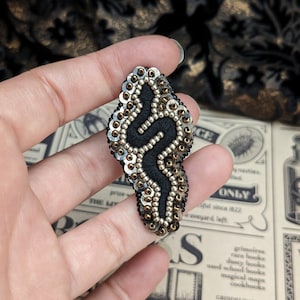 Le Fabularium Black and brown snake brooch in pearls and sequins, hand embroidered. image 1