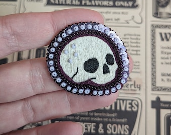 The Fabularium Hand Embroidered Lilac Sequin Skull Brooch | Skull | Bones | Biology Pin | gothic jewelry | Scary