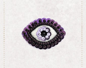 Le Fabularium - Broche œil lilas violet brodée à la main | broderie de perles