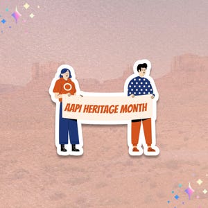 May include: A sticker featuring two cartoon figures holding a banner that reads "AAPI HERITAGE MONTH." One figure wears an orange hoodie and blue pants, the other a blue polka-dot shirt and orange pants. The background is a pinkish-brown.