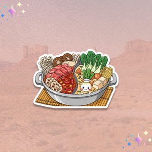 May include: A sticker featuring a divided pot of hot pot with various ingredients. One side contains red broth with meat and vegetables, the other has a creamy broth with tofu and noodles. The sticker is on a bamboo mat.