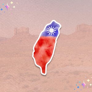 May include: A watercolor sticker in the shape of Taiwan, featuring the flag's design. The top half is blue with a white sun, and the bottom half is red. The sticker has a white border and is set against a pink background.