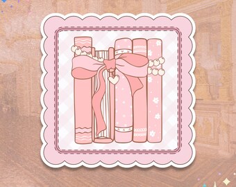 May include: A stack of pink books with a pink bow and pearl beads. The books are decorated with white lace and floral patterns.