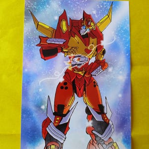 May include: A vibrant illustration of a red and gold robot character with blue accents, set against a starry, blue and white background. The robot has sharp, angular features and is in a dynamic pose, suggesting action.