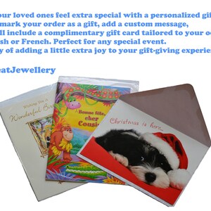 May include: Greeting cards for various occasions, including a birthday and Christmas. One card features a puppy wearing a Santa hat. The text "Christmas is here" is visible on one card. The brand name "MaxNeatJewellery" is also visible.