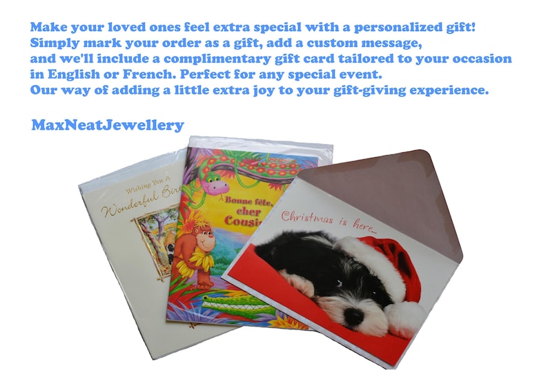 May include: Greeting cards for various occasions, including a birthday and Christmas. One card features a puppy wearing a Santa hat. The text "Christmas is here" is visible on one card. The brand name "MaxNeatJewellery" is also visible.