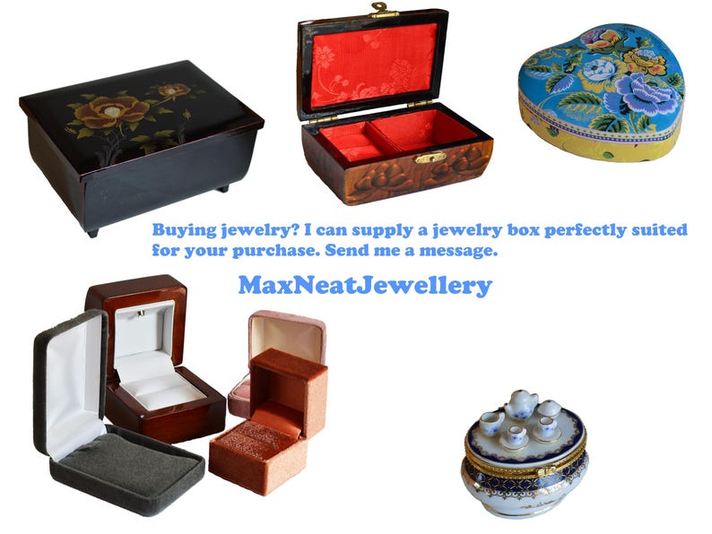 May include: Assortment of jewelry boxes in various shapes and styles. Includes a black rectangular box with floral design, a heart-shaped box with floral pattern, and several ring boxes. Text: MaxNeatJewellery.