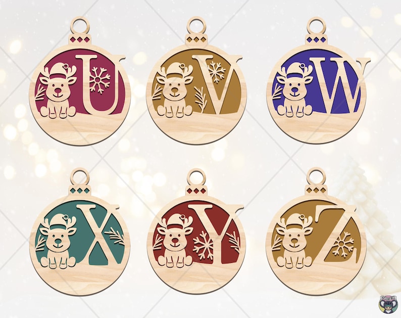 May include: Wooden Christmas ornaments featuring the letters U, V, W, X, Y, and Z. Each ornament has a reindeer design and is painted in various colors, including burgundy, brown, blue, teal, and red. The ornaments are round with a loop for hanging.