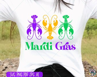 May include: A white t-shirt with a purple, green, and yellow design of three crawfish with the text "Mardi Gras" in green and purple.
