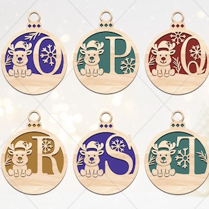 May include: Wooden Christmas ornaments with letters O, P, Q, R, S, and T. Each ornament features a reindeer wearing a Santa hat, a snowflake, and a letter. The letters are in various colors, including blue, red, and brown.